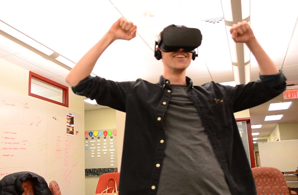 Player with an Oculus headset, with first raised in celebration